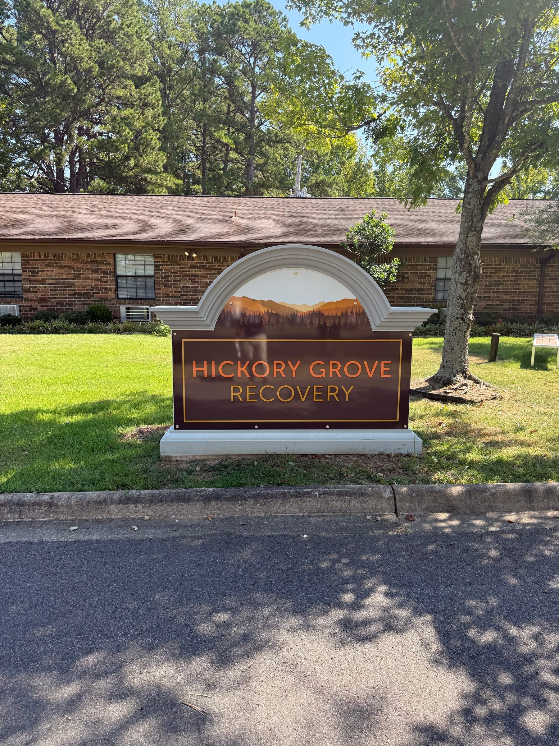 The Hickory Grove Recovery sign beside the front drive at 12 Hospital Drive in Morrilton, Arkansas