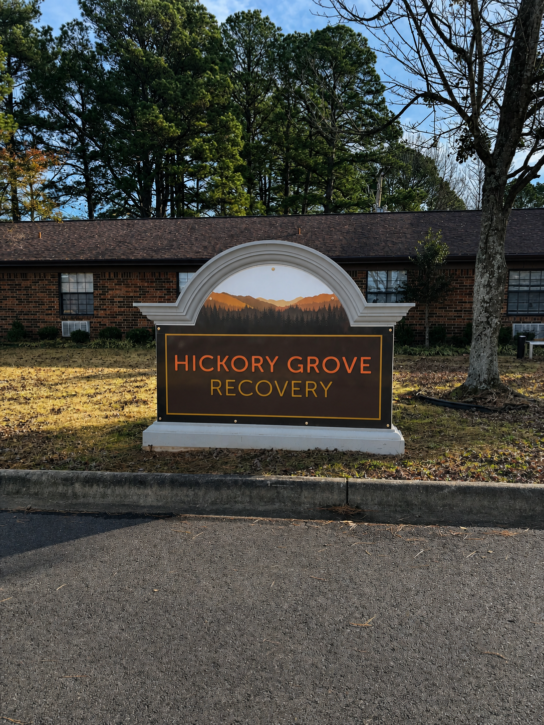 The Hickory Grove Recovery monument sign and brick building in Morrilton, Arkansas.