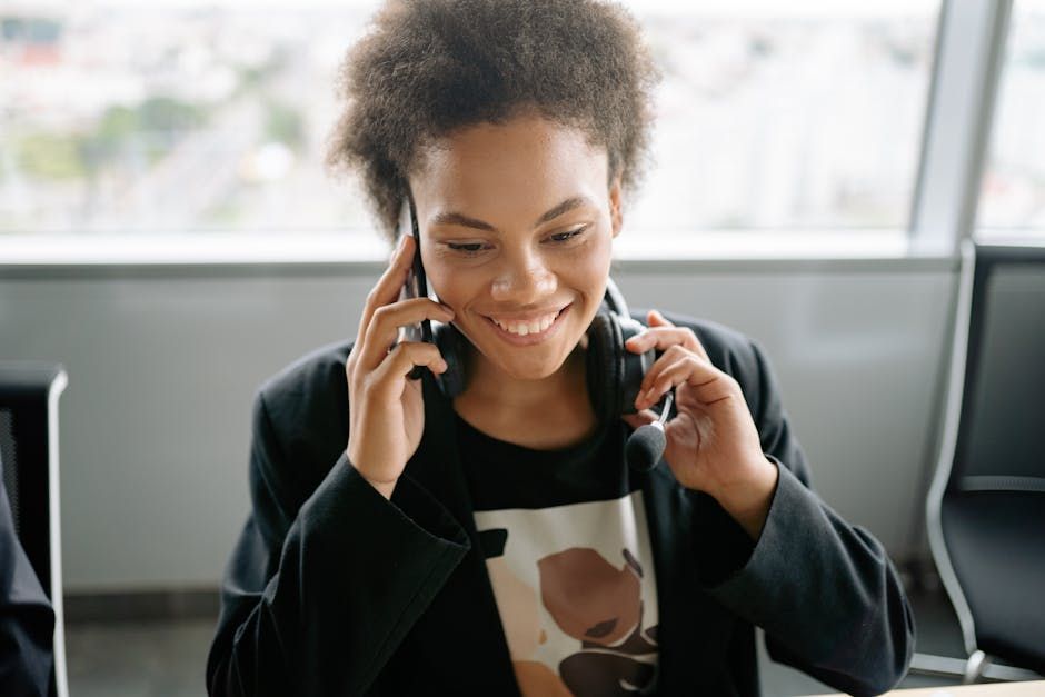 A woman taking a phone call, sunlight across her face