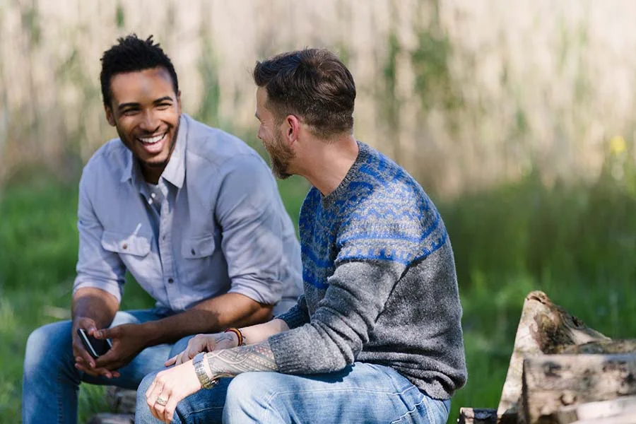 two men who are alumni of the same treatment program catch each other up on their lives