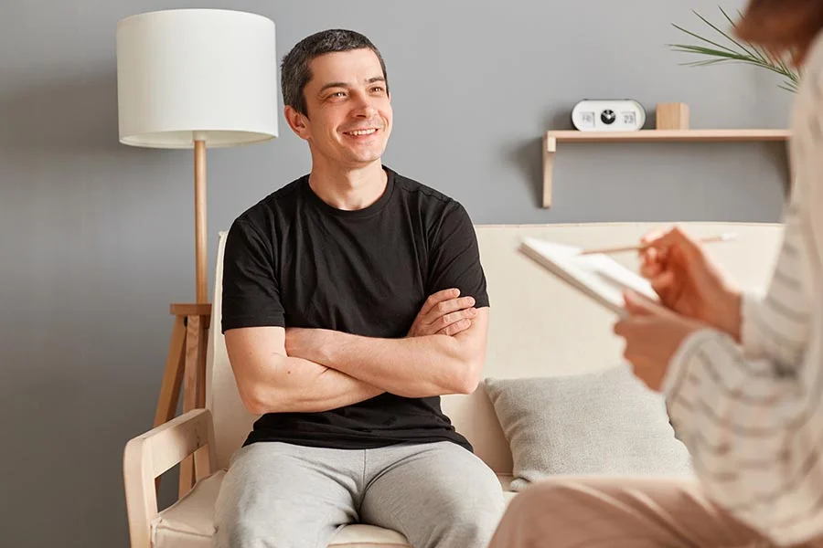 a man discusses his progress with medication-assisted treatment with his counselor