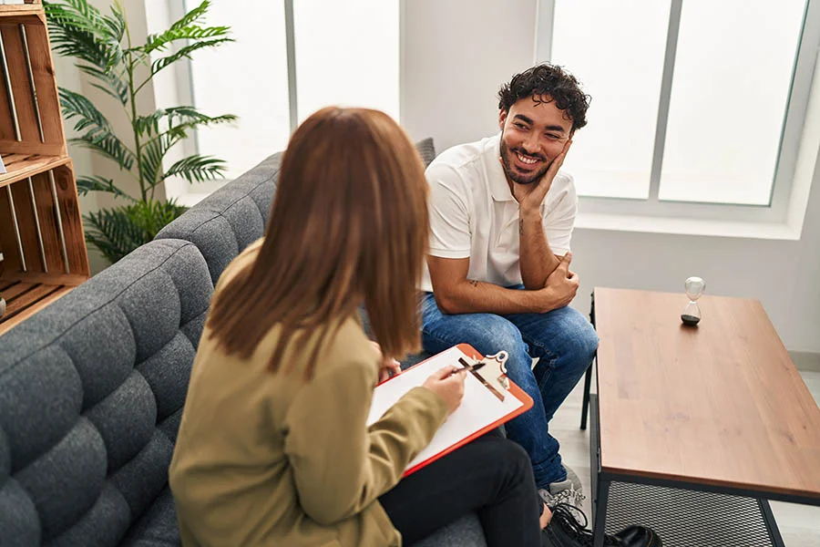 a man opens up to his treatment specialist in therapy