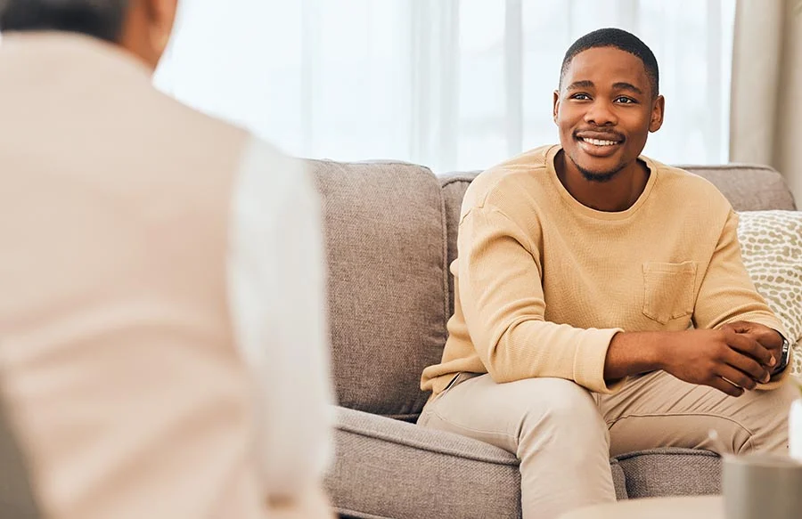a man speaks with a counselor in therapy as part of cooccurring disorders treatment