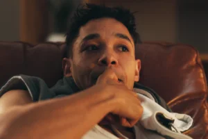 Man chewing on finger nails