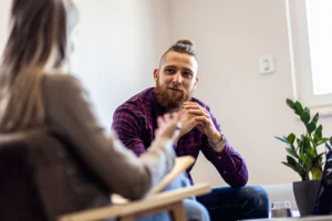 Man talking to therapist about addiction